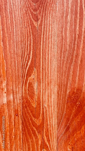 Macro of Warm-Toned Stained Wood Surface — Rich Red-Brown Grain, Natural Knots, and Subtle Moisture Droplets