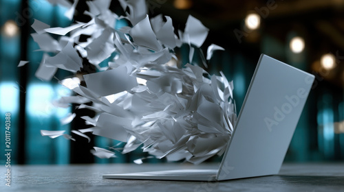 Laptop flying paper data overload digital chaos information explosion office desk stress document management technology motion blur Minimalist laptop office desk with flying paper showing data