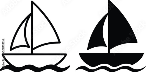 Fotografie Contrast between a white and black sailboat on calm waters