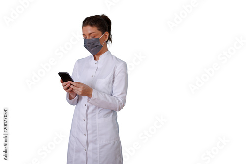 Fotografie Female medical worker looking at phone screen, performing telecare or online healthcare services with digital device