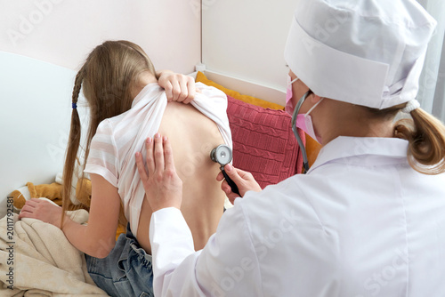 Εκτύπωση καμβά Doctor examining girl with stethoscope at home, Medicine and healthcare concepts