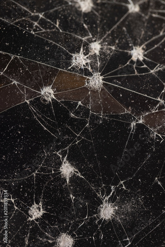 Foto dents and dots on the glass where it broke, white cracks and completely broken p