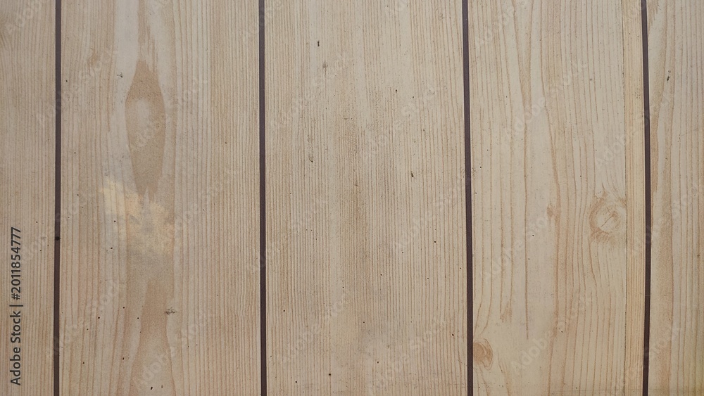 Fototapeta premium Natural light pine wood plank texture background. Clean wooden panel surface with vertical grain and knots. Rustic timber backdrop for product placement and graphic design copy space