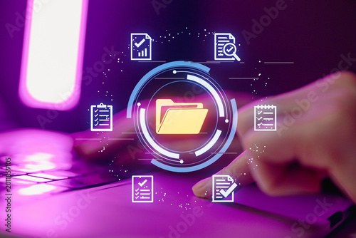 Working on digital files in a modern workspace with technology and data visualization