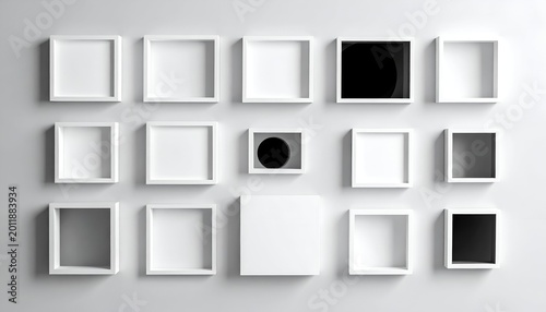 Minimalist wall display with square frames, some filled with black