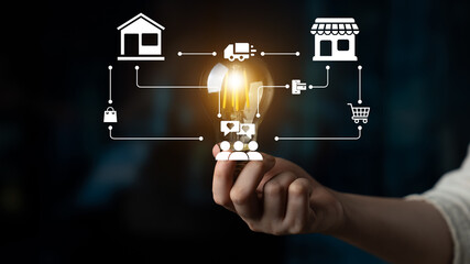This image illustrates a hand holding a light bulb with icons representing innovative solutions in home delivery, e-commerce, and logistics, showcasing modern business strategies. Ledger
