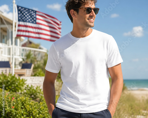 portrait of a young man standing in front of the usa flag wearing white blank shirt for advertisement, 
