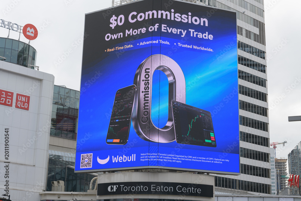 Naklejka premium digital billboard at Sankofa Square featuring advertisement for Webull, an electronic trading platform, Toronto