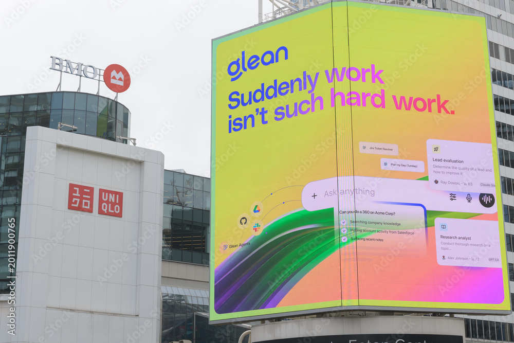 Naklejka premium digital billboard featuring advertising for glean artificial intelligence on the exterior of CF Toronto Eaton Centre, a shopping mall, facing Sankofa Square, Toronto