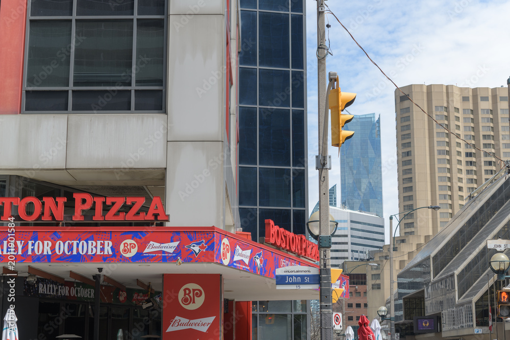 Fototapeta premium exterior of Boston Pizza, a pizza restaurant chain, located here at 250 Front St W at John St, Toronto