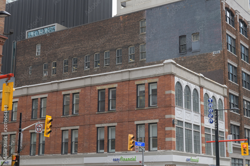 Naklejka premium exterior building and sign of easyfinancial Services, a loan agency, located at 221 Yonge St (corner of Shuter St), Toronto (John E. Thompson Block, 1886)