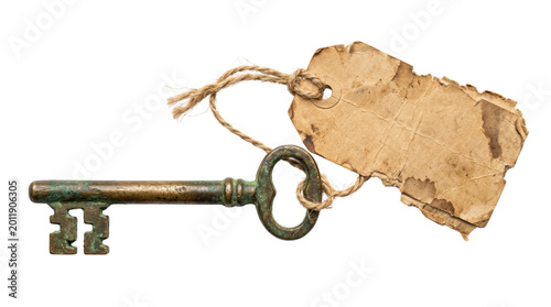 Фотография Antique brass skeleton key with blank vintage paper tag