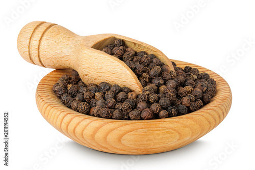 Black peppercorns or pepper in a wooden bowl and scoop isolated on a white background