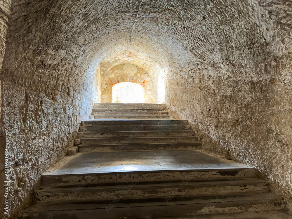 Fototapeta premium Stone vaulted staircase inside the New Fortress in Corfu Town Greece.