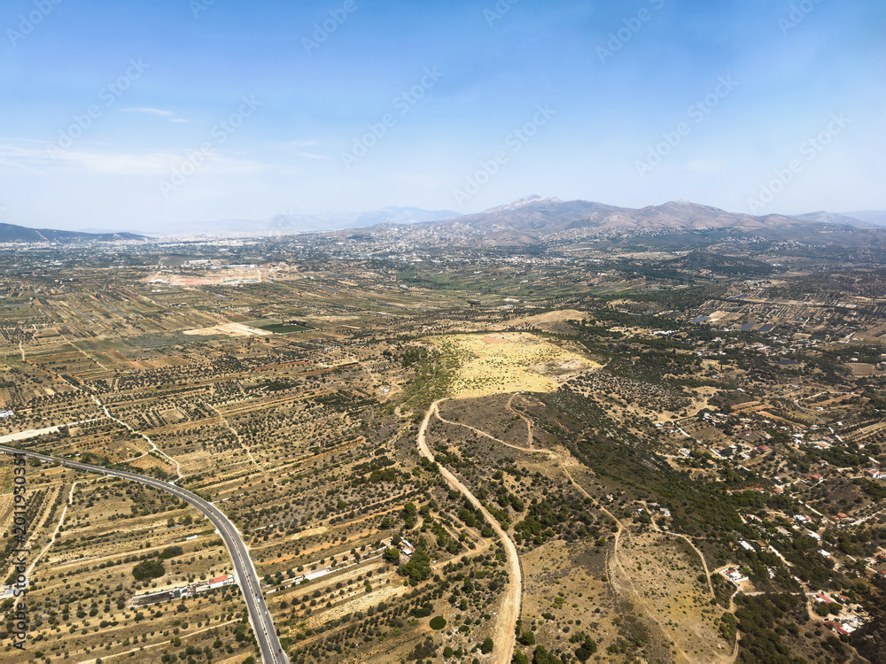 Obraz premium Aerial view of rural landscape and mountains near Spata area, Attica, Greece.