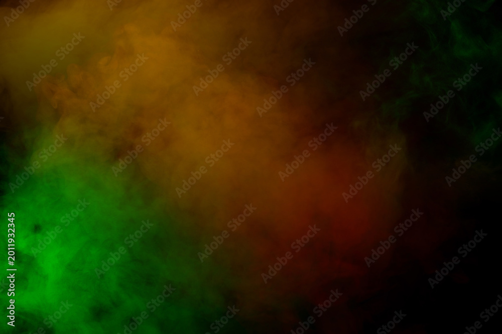 Fototapeta premium Orange and red steam on a black background.