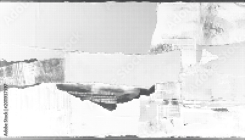 A grayscale image of torn and ripped paper with transparent background layers on a desk indoors