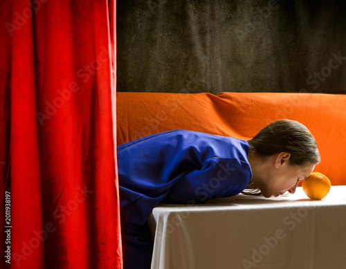 Scene of a woman in an interior behind a velvet curtain IV