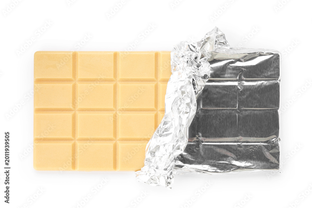 Fototapeta premium One tasty chocolate bar wrapped in foil isolated on white, top view