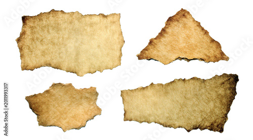 Foto Four pieces of aged crumpled parchment paper with torn edges and vintage texture