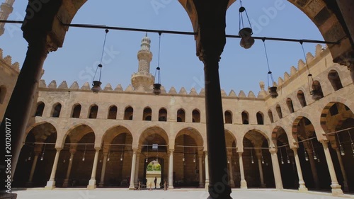 Horizontal camera movement through a historic mosque courtyard in Cairo, Egypt, captured in cinematic slow motion 4K during travel.