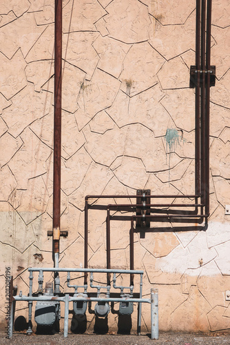 Tableau sur toile Utility meters in rundown urban alley