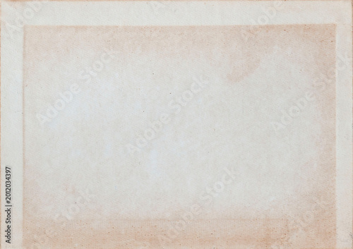 Old paper texture with stains, faded border, grain, blank center for stationery, archive, scrapbook, design. Natural background paper for mockup, copy space, banner, invitation, branding