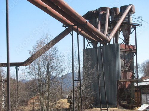 Industrial pipelines for sawdust collection in a cyclone system at a wood processing plant