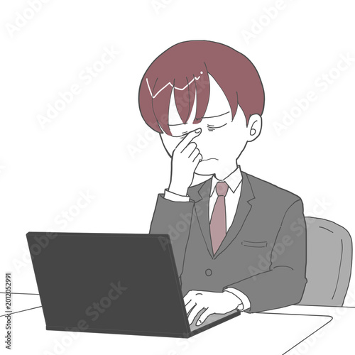 Foto デスクワークで目頭を押さえる男性