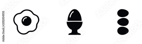 Schilderij op canvas Minimalist black and white icons of eggs, including a sunny side up fried egg, a boiled egg in an egg cup, and a stack of three whole eggs