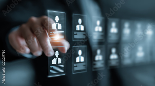 Candidate Selection Concept in Human Resources featuring businessperson analyzing resumes on digital interface, choosing qualified applicant during online job application review process 
