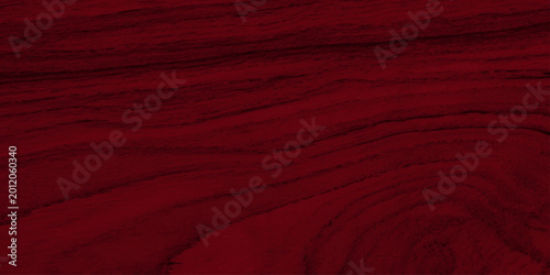 Schilderij op canvas Deep red mahogany wood texture background with natural wavy grain patterns
