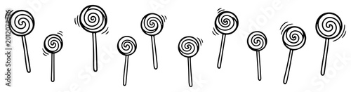 Swirl lollipop candy border with various spiral shapes and sticks in hand drawn doodle style