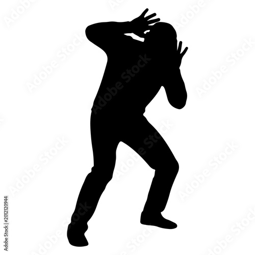Foto Silhouette of a person shielding their head in fear or surprise.