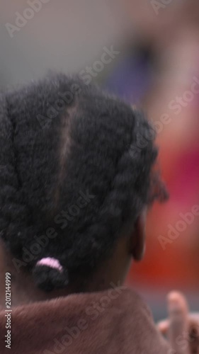 Woman vibes dancing head close up rear view afro braids