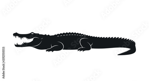 Fotografie Black silhouette of a crocodile.