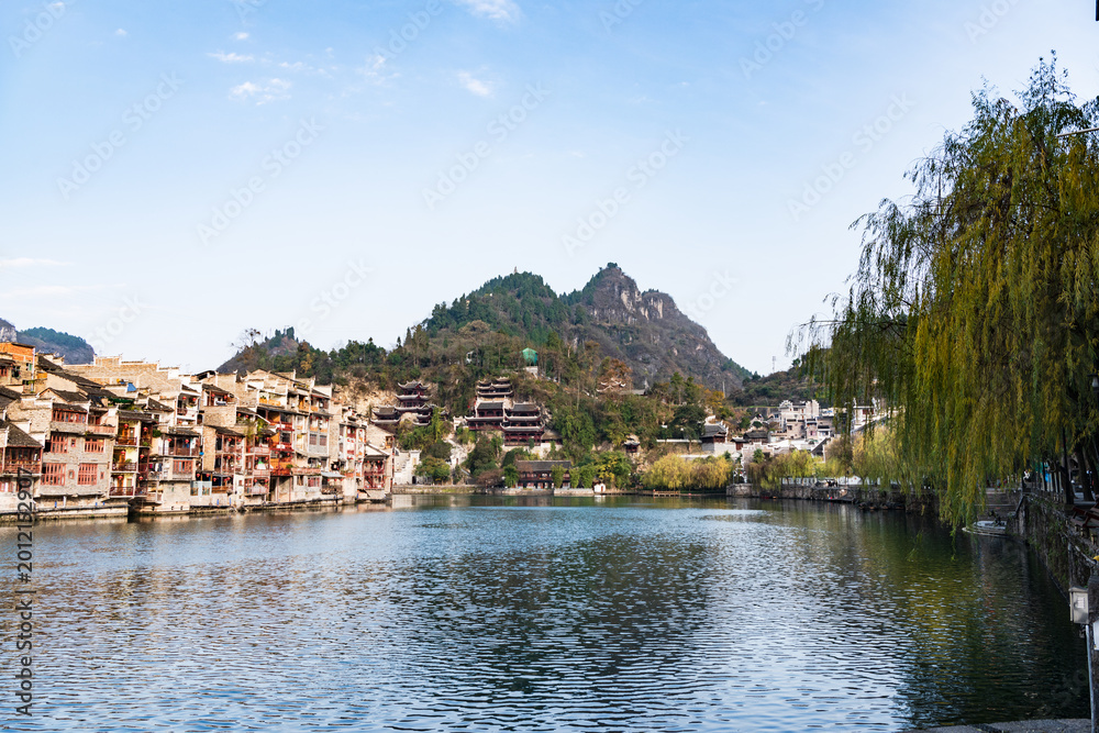 Fototapeta premium Panoramic Winter Sunset Scenery of Zhenyuan Ancient Town in Qiandongnan, Guizhou, China