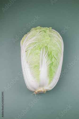 Fresh Chinese cabbage on green background.  Organic vegetable Healthy nutritional food.