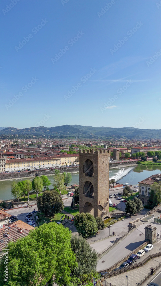 Obraz premium Aerial drone view Florence Lungarni Arno River banks with historic buildings colorful facades Ponte Vecchio and Tuscan cityscape