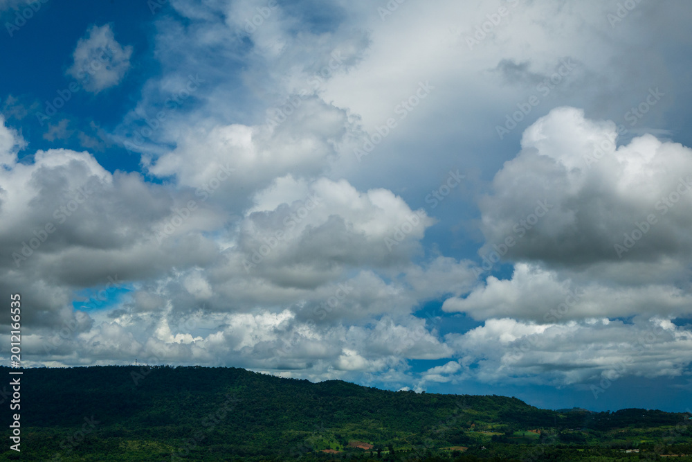 Obraz premium Amazing landscape fog mountain clouds scenery. Beautiful Mountain landscape foggy windy mountain range green landscape asian farm. Landscape mountain green field meadow white cloud blue sky sunrise