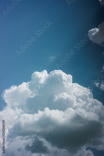  White Cumulus Clouds in a Blue Sky