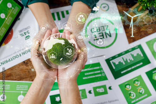 Fotografie ESG concept with a hand holding a moss earth globe and environmental icons for sustainable business, CSR, and nature conservation