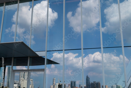 The skyscraper architecture reflected on the glass curtain wall
