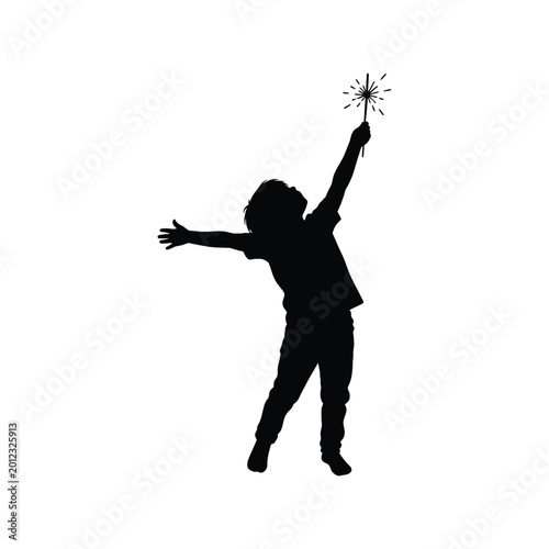 Black silhouette of a happy child holding a glowing sparkler firework up in the air with open arms