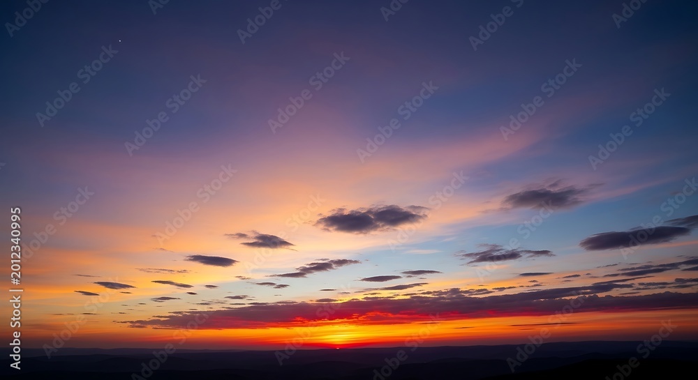 Fototapeta premium Vibrant sunset with orange and purple hues in the sky