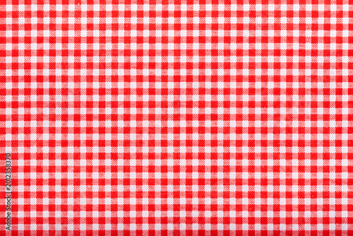 Schilderij op canvas above of placemat fabric cloth or arrangement of gingham-patterned red fabrics background