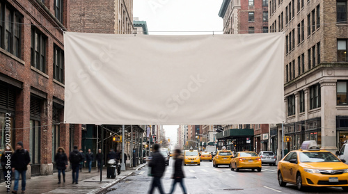 Large blank mockup banner suspended over urban street