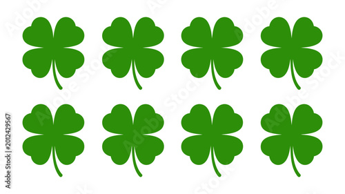 Eight green four leaf clover silhouettes against a white background lucky charm design high quality professional