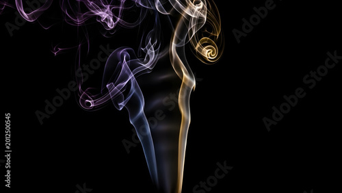 Abstract purple and yellow smoke swirls on black background