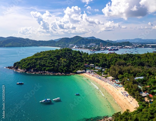 Aerial view of a tropical beach and bay with boats (1)